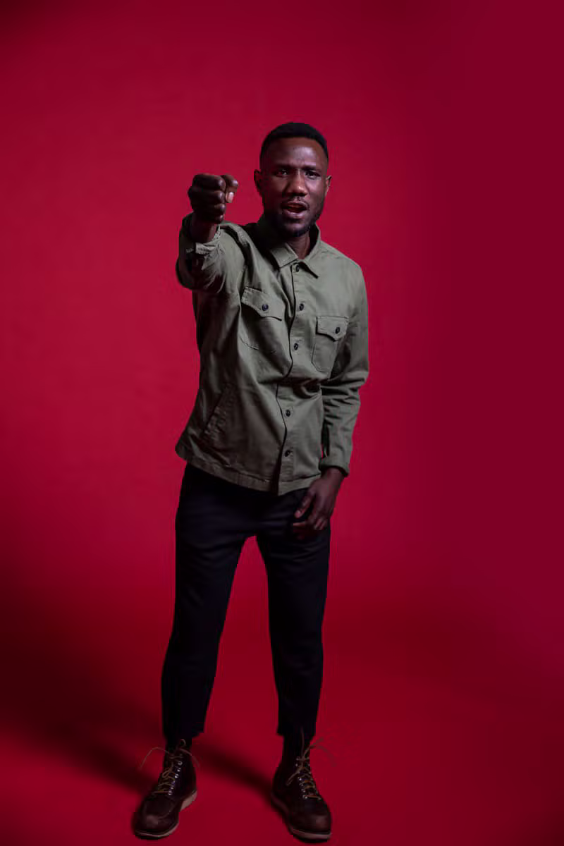 Nigerian male model wearing a structured safari suit