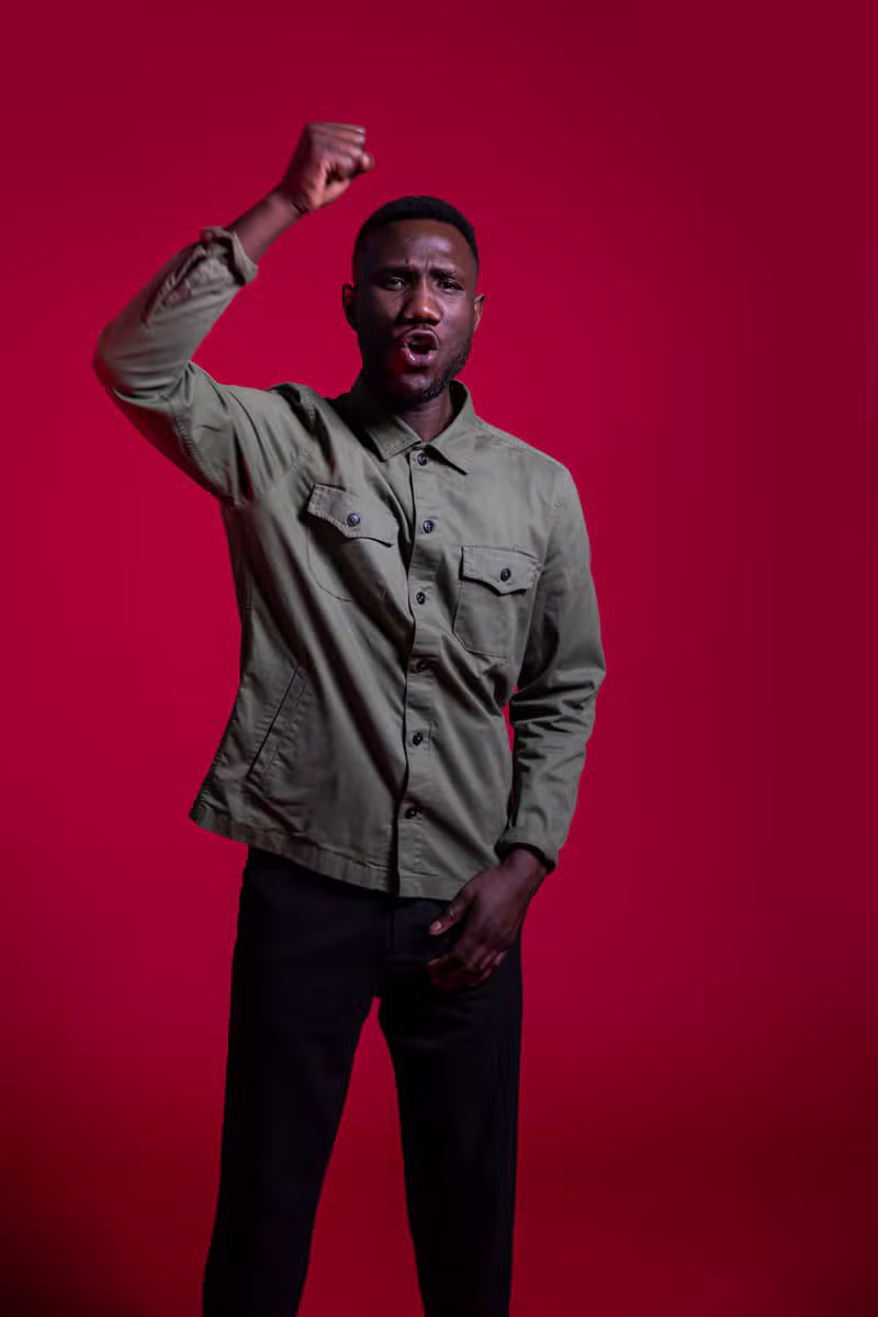 African male model wearing a sharp contemporary safari suit