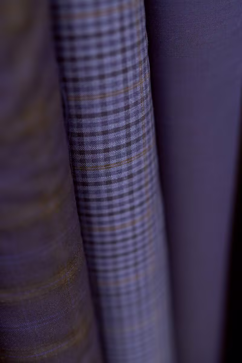 Close-up traditional menswear fabric rolls
