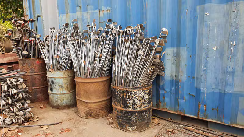 Large pile of golf clubs in bulk