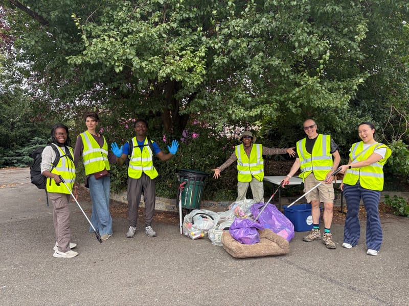 Happy volunteers working together outdoors