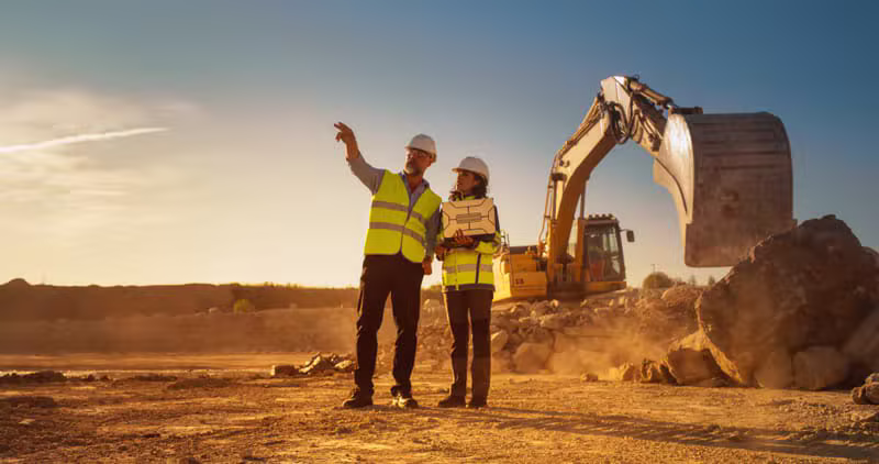 Corporate mining professionals at industrial site