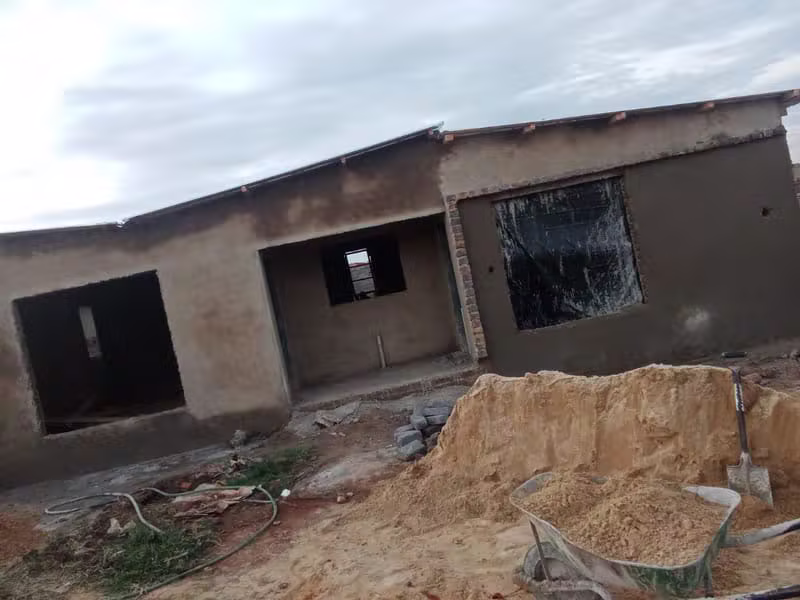 Newly plastered residential building exterior under construction