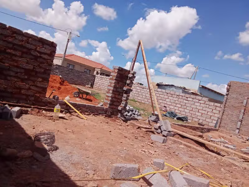 Brick foundation and boundary wall under construction