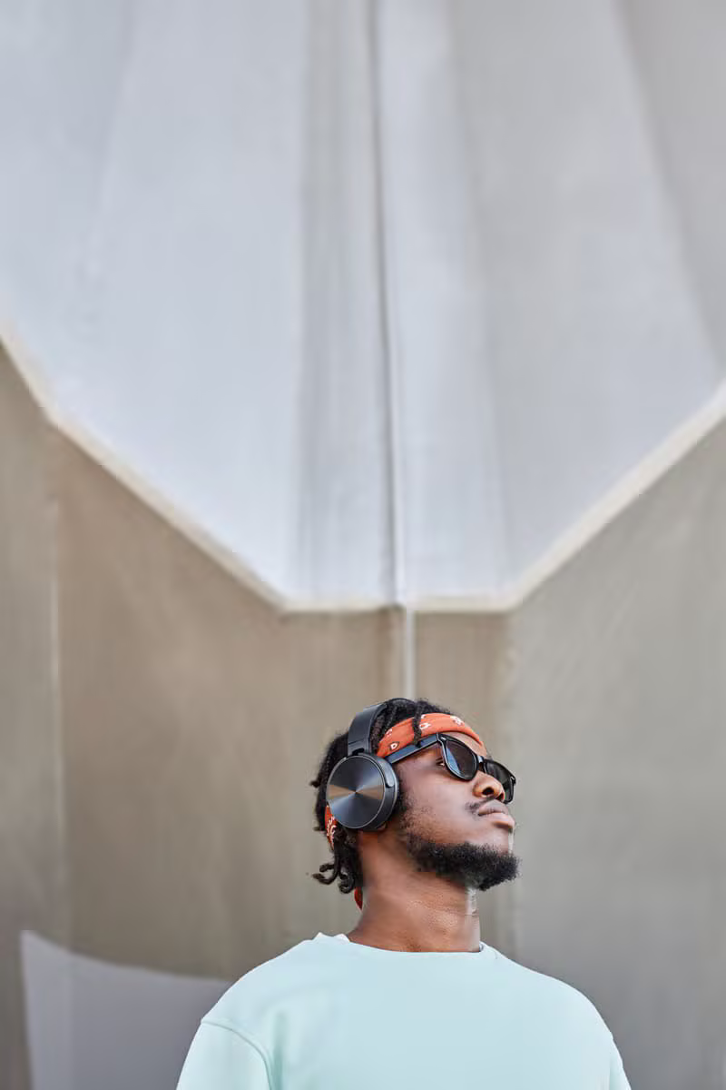 young black guy listening to headphones