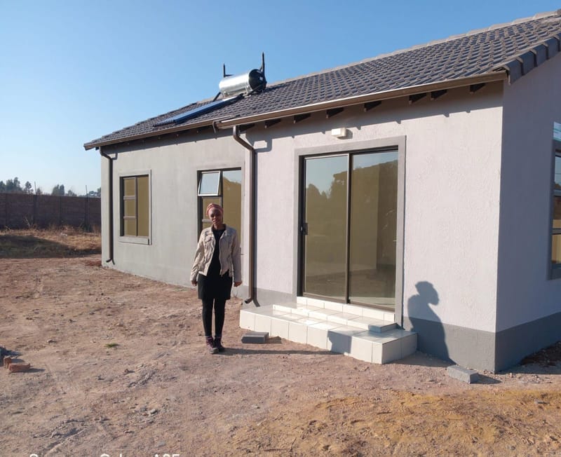Home inspector checking the exterior of a suburban house