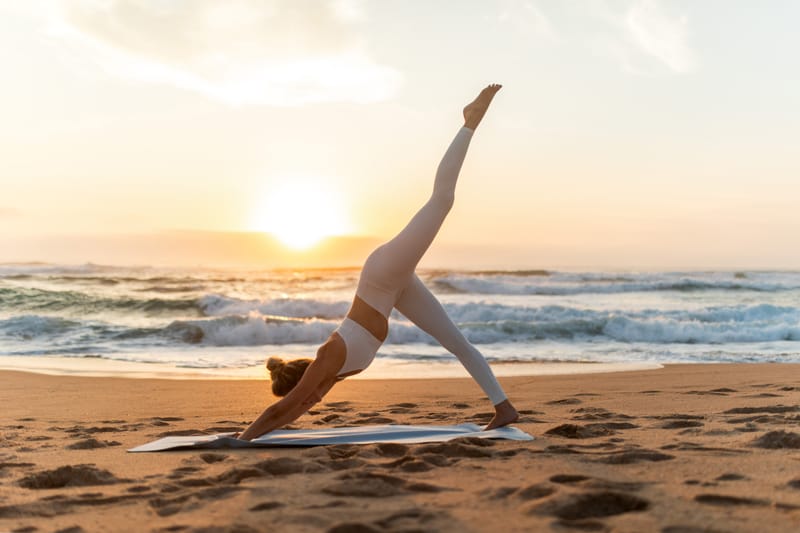 Woman moving and stretching in warm sunlight