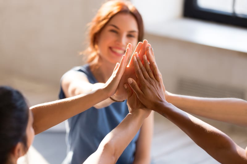 Woman speaking at a warm sunlit workshop