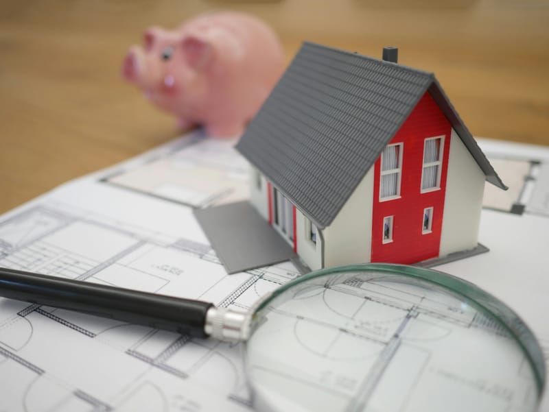 Home inspector reviewing a digital report with a buyer
