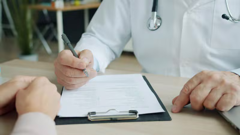 Clinician reviewing hormone test results with a patient