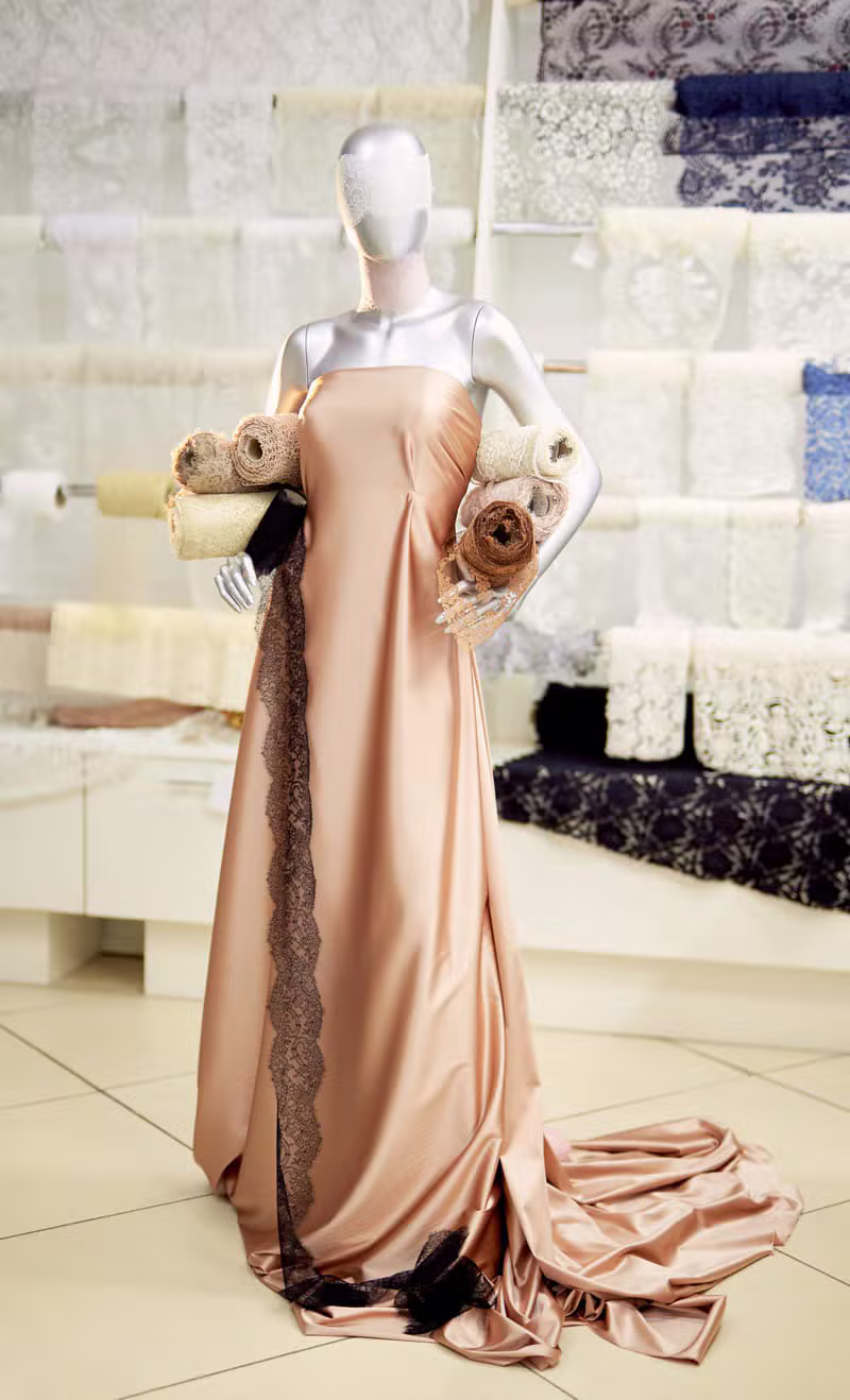 A toiled couture dress on a mannequin in the OpalThread studio