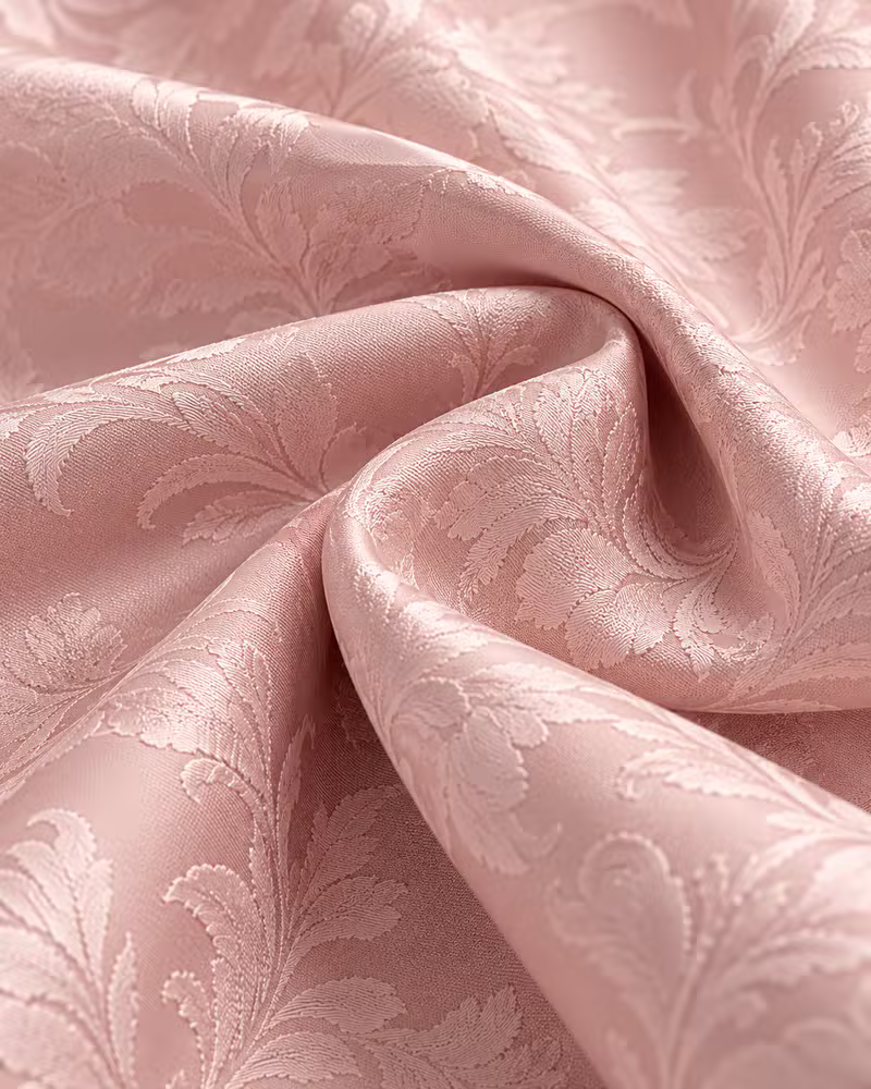 Blush pink silk brocade woven with a floral damask motif