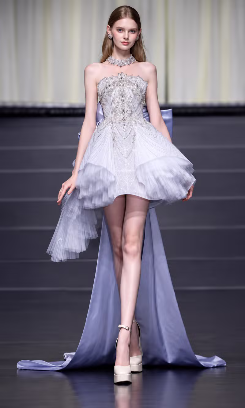 Silver beaded couture mini dress with tiered tulle ruffles and a long lilac satin train