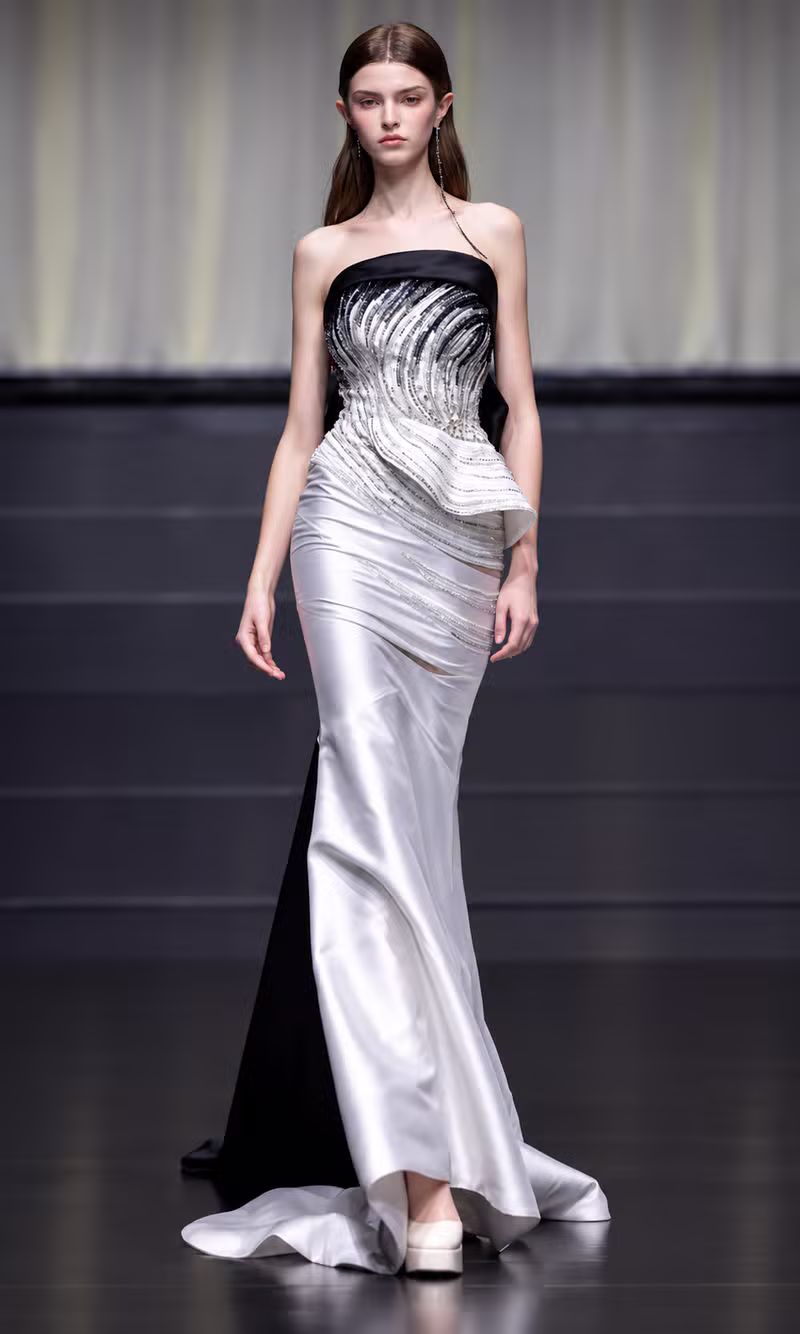 Black and silver satin couture gown with a beaded swirl bodice