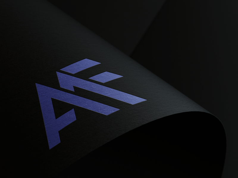 AMF monogram logo in indigo applied to a dark textured surface