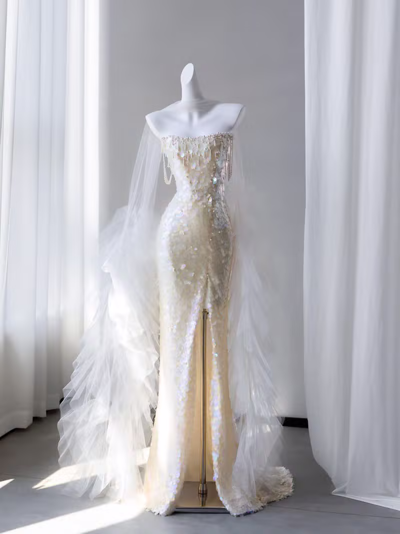 Golden Elegance — Ivory silk with gold embroidery and delicate feather accents by KALVERE LUMIERE