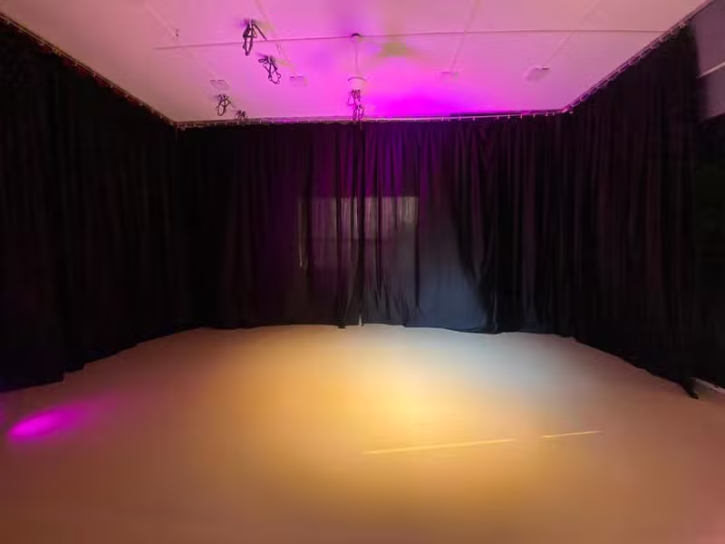 MiCasa dance studio with mirrored wall and logo