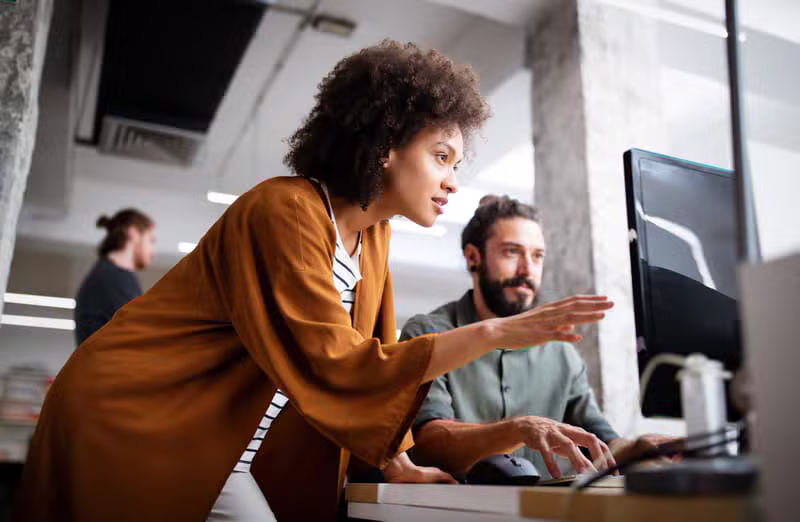 Black accounting team working together in a bright modern office