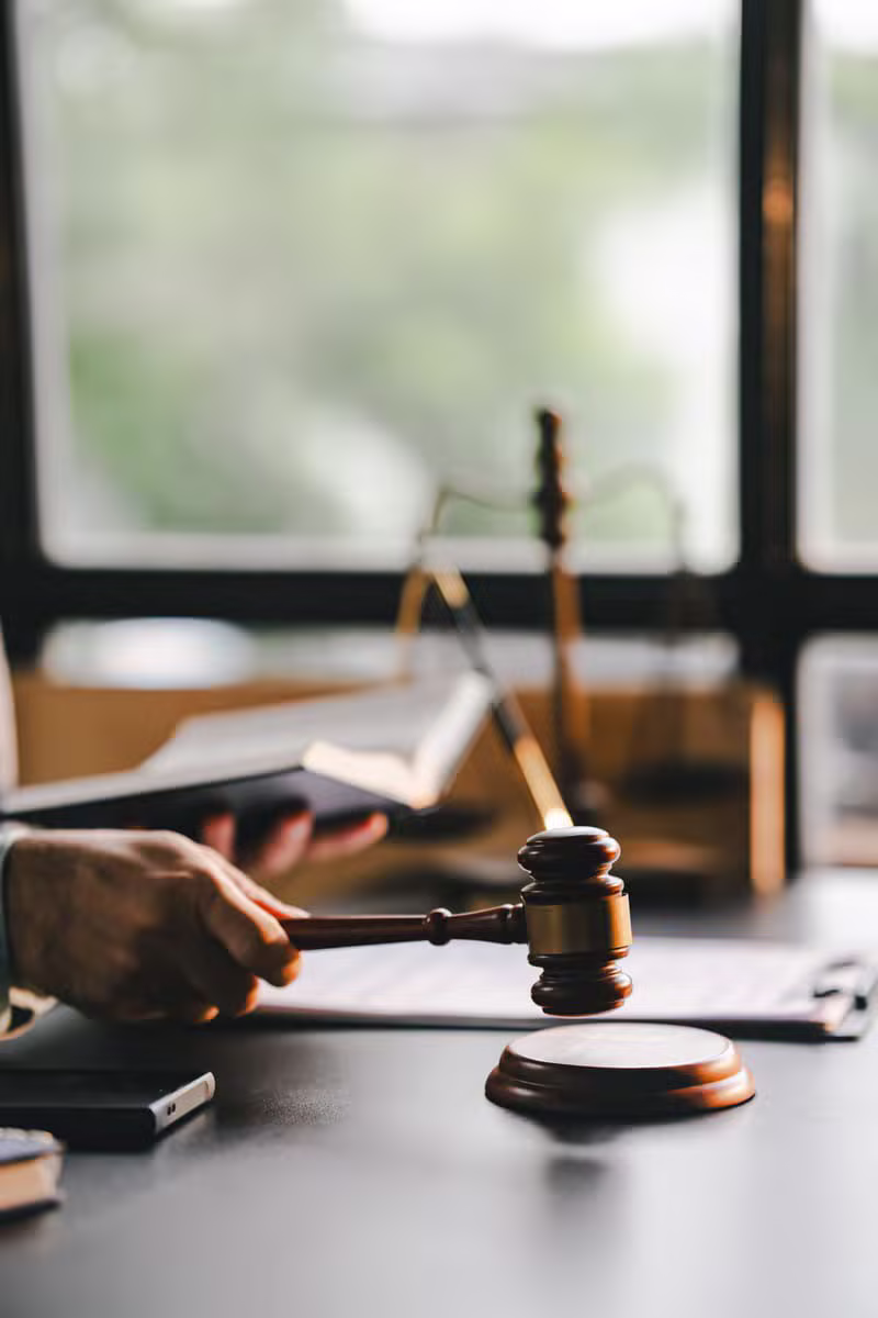 Scales of justice and law books in the firm's office