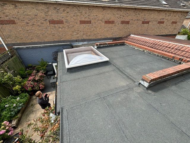 new flat roof waterproofing and installation of skylight