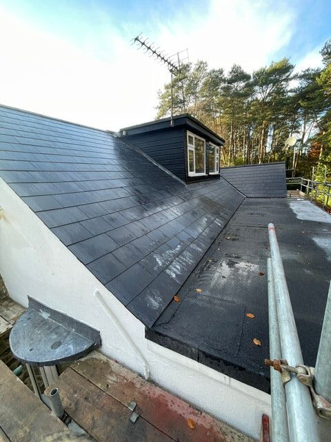 new bitumen flat roof and fibercement slate roof