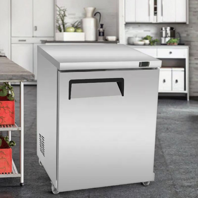 Why should a new commercial refrigerator be left to stand for a while before use?