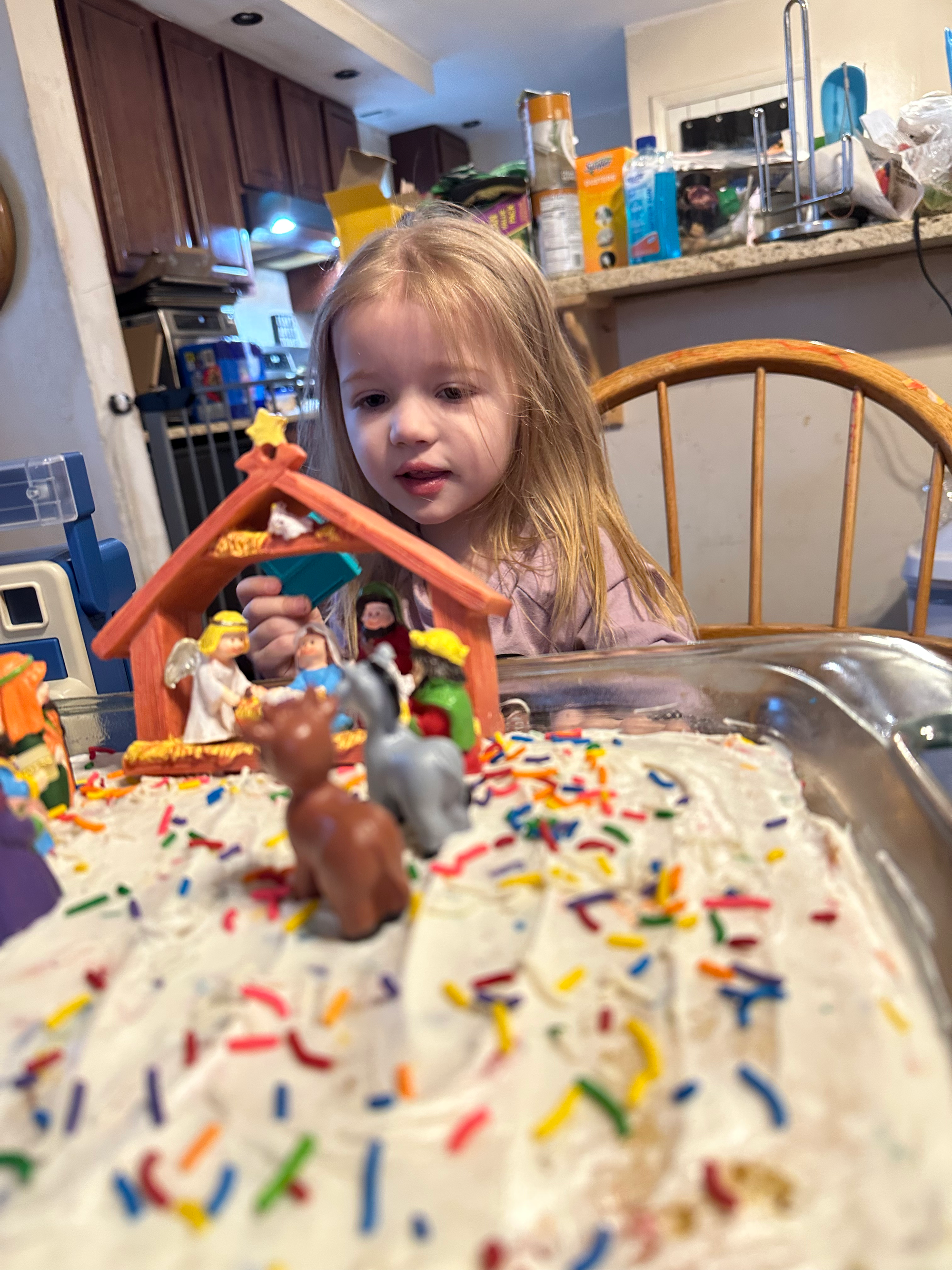 TGC BABY LAMBS DECORATING JESUS' B/DAY CAKE