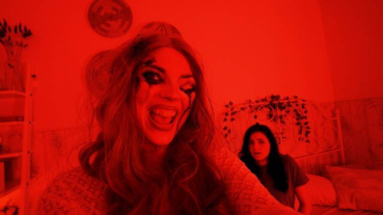 A person with red makeup and her mouth openAI-generated content may be incorrect.