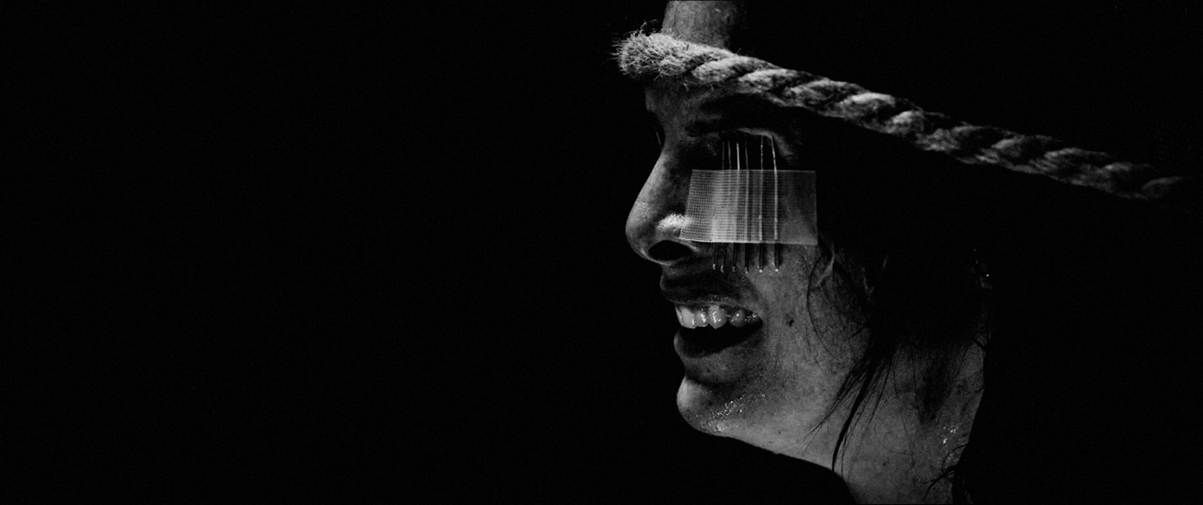 A person with a rope around her faceAI-generated content may be incorrect.