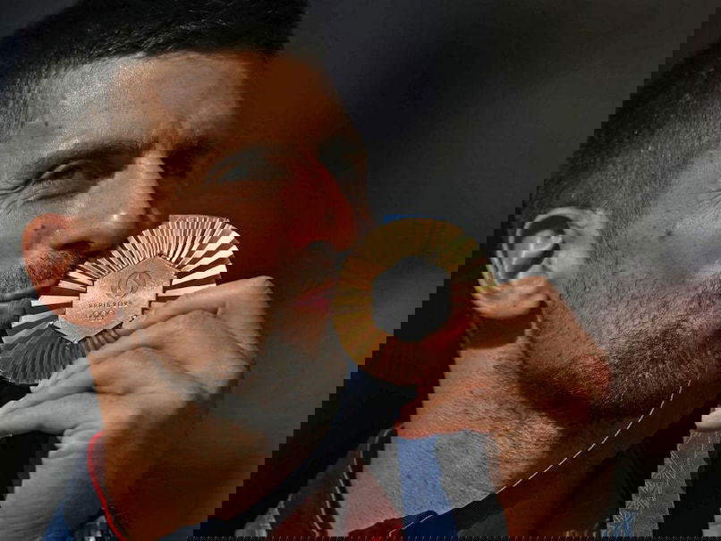 LEGENDARY  NOVAK DJOKOVIC COMPLETES OLYMPIC GAMES TENNIS GOLDEN SLAM 2024 WITH MEN'S SINGLES GOLD,PARIS.