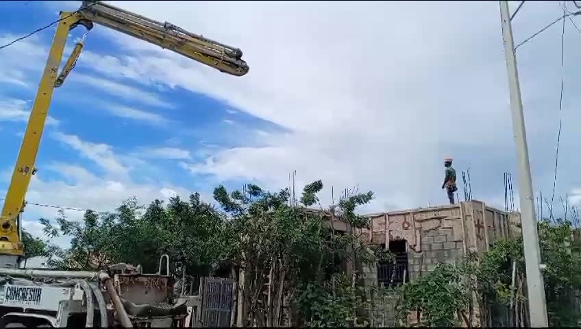 Pouring concrete for the roof