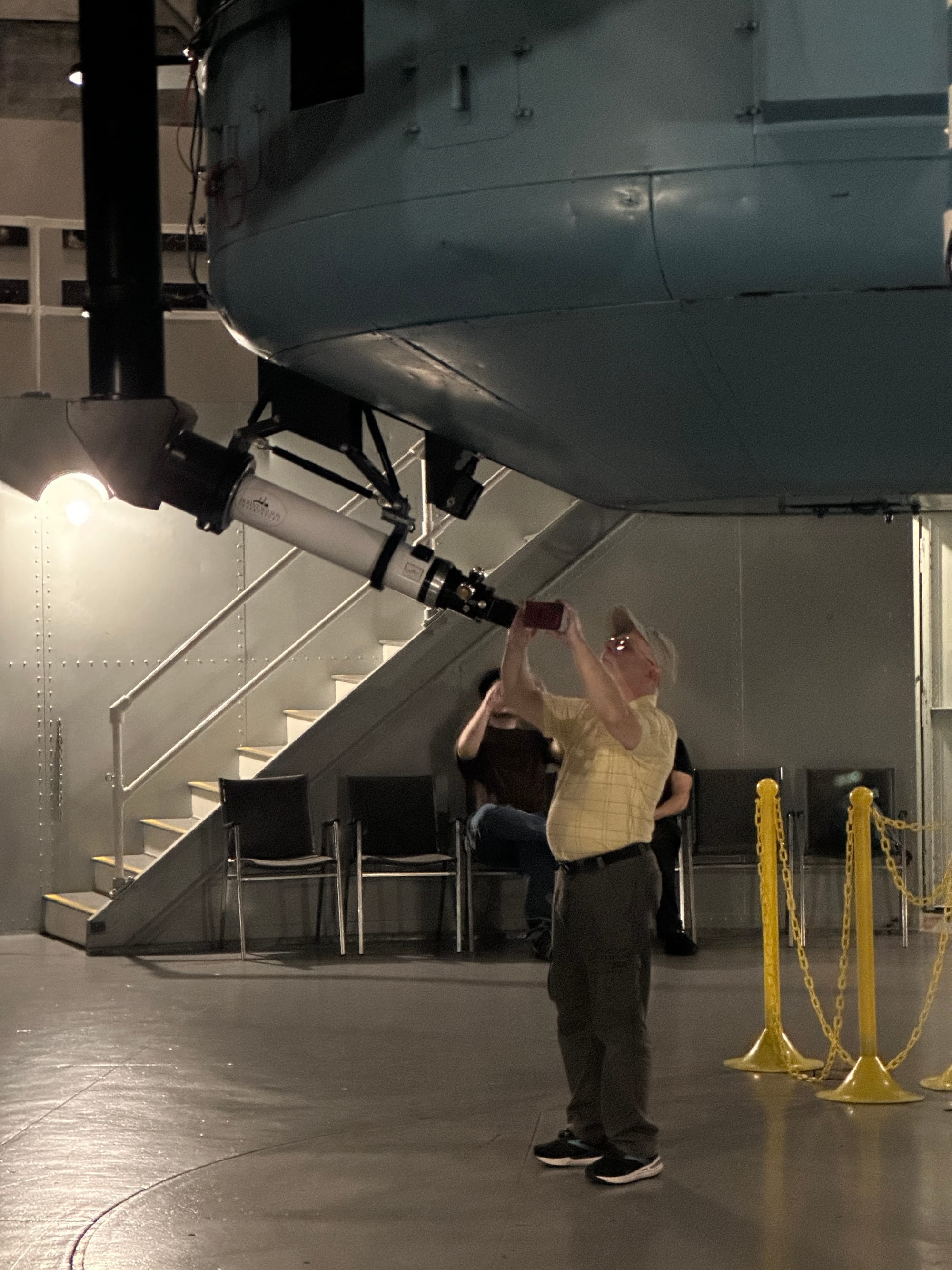 A member looking through the telescope