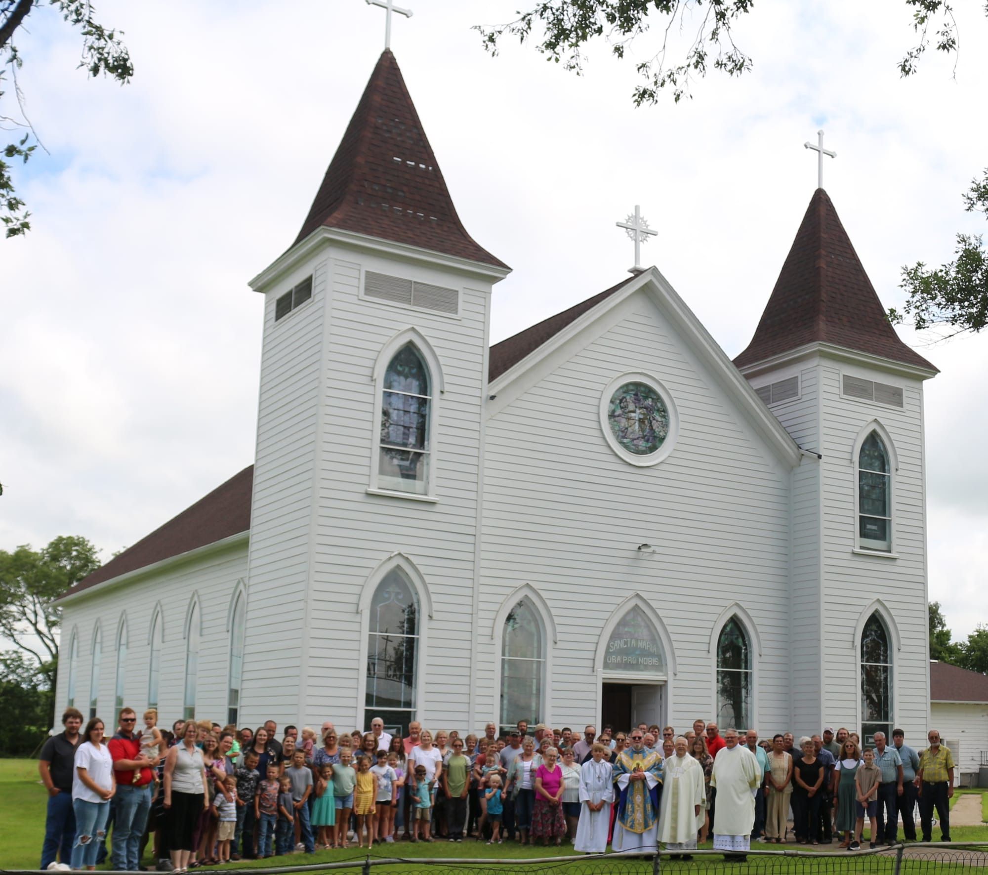 People attending Mass at OLMC Mass 2025