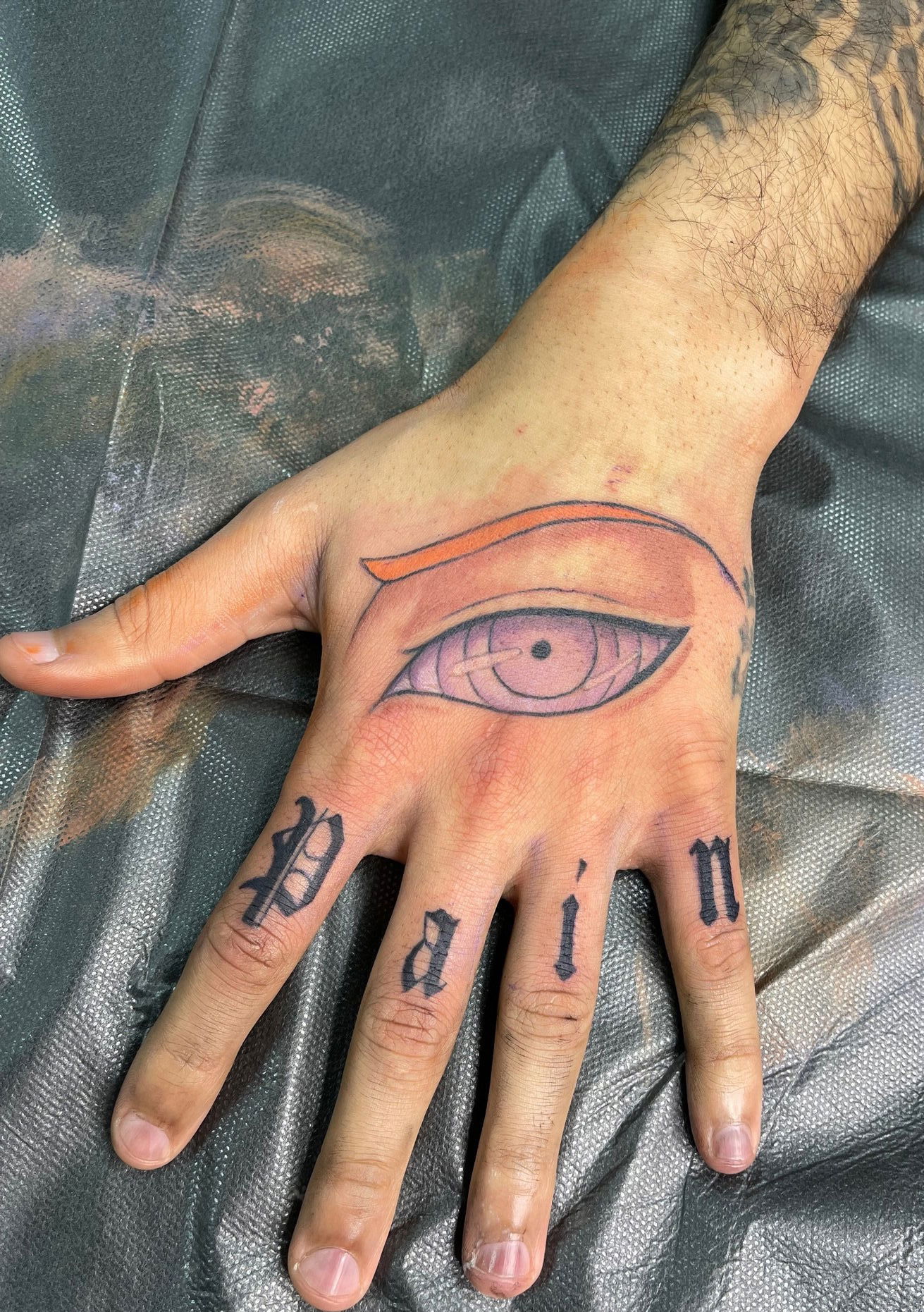 Pain Hand Tattoo