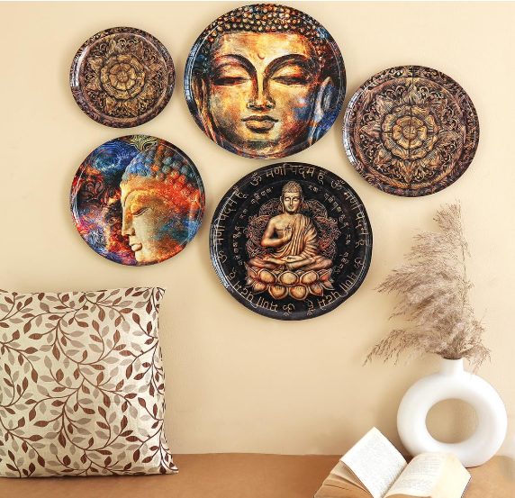 Close-up of the wall plates laid out against a textured background, emphasizing the intricate craftsmanship and design details.