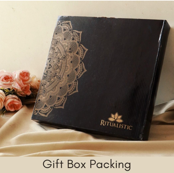 Elegant black gift box with gold accents labeled “Gift Box Packing,” surrounded by soft decor elements, suggesting premium presentation for the handmade wall plates.