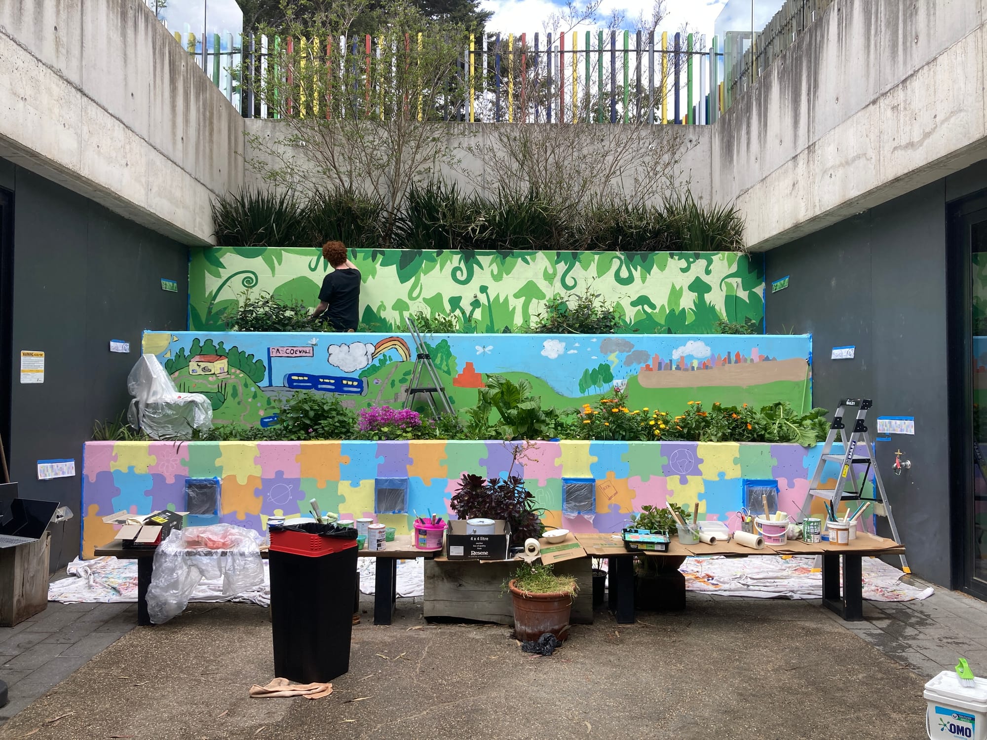 painting mural with youth at Sussex Neighbourhood House