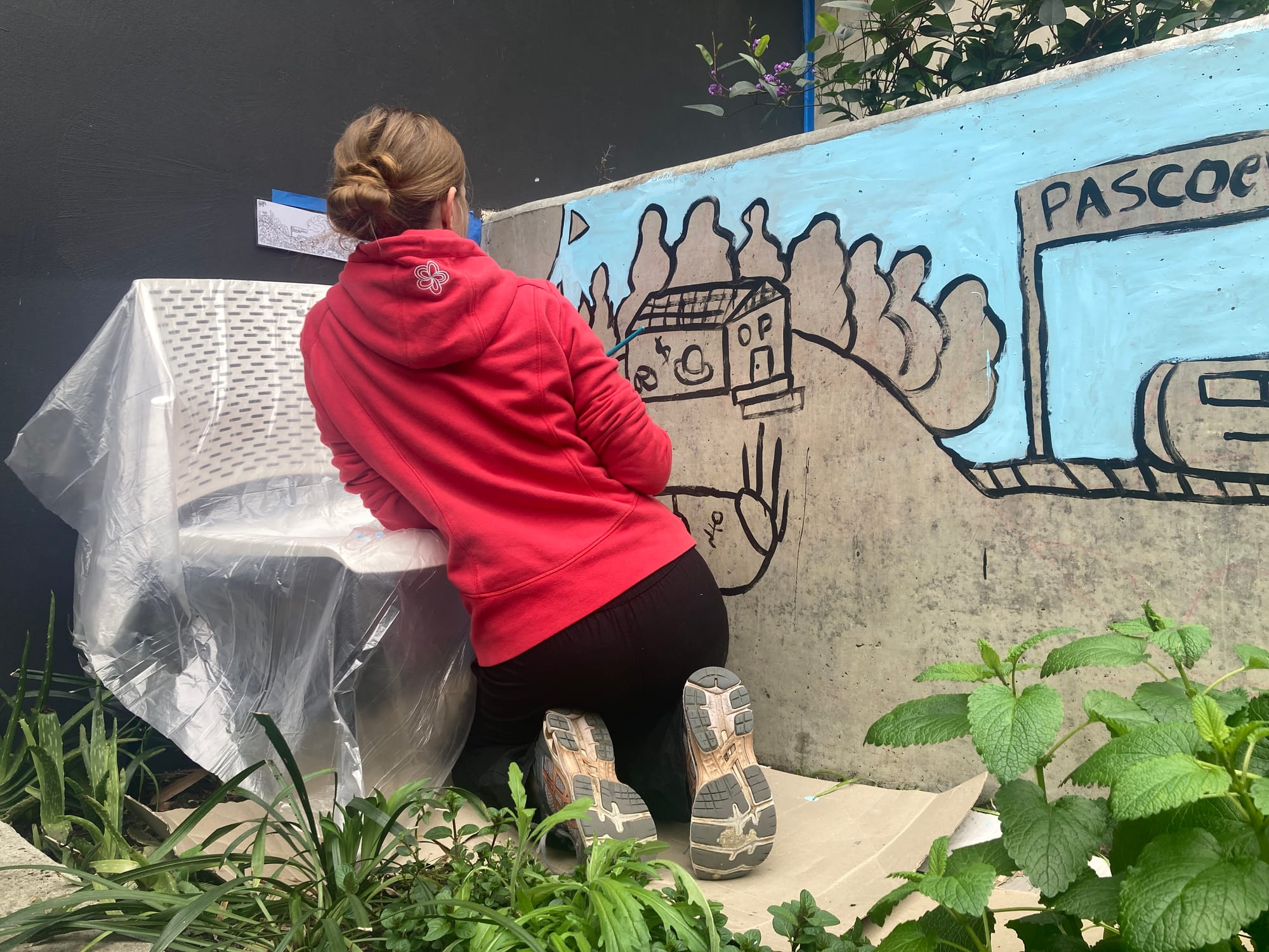 painting mural with youth at Sussex Neighbourhood House