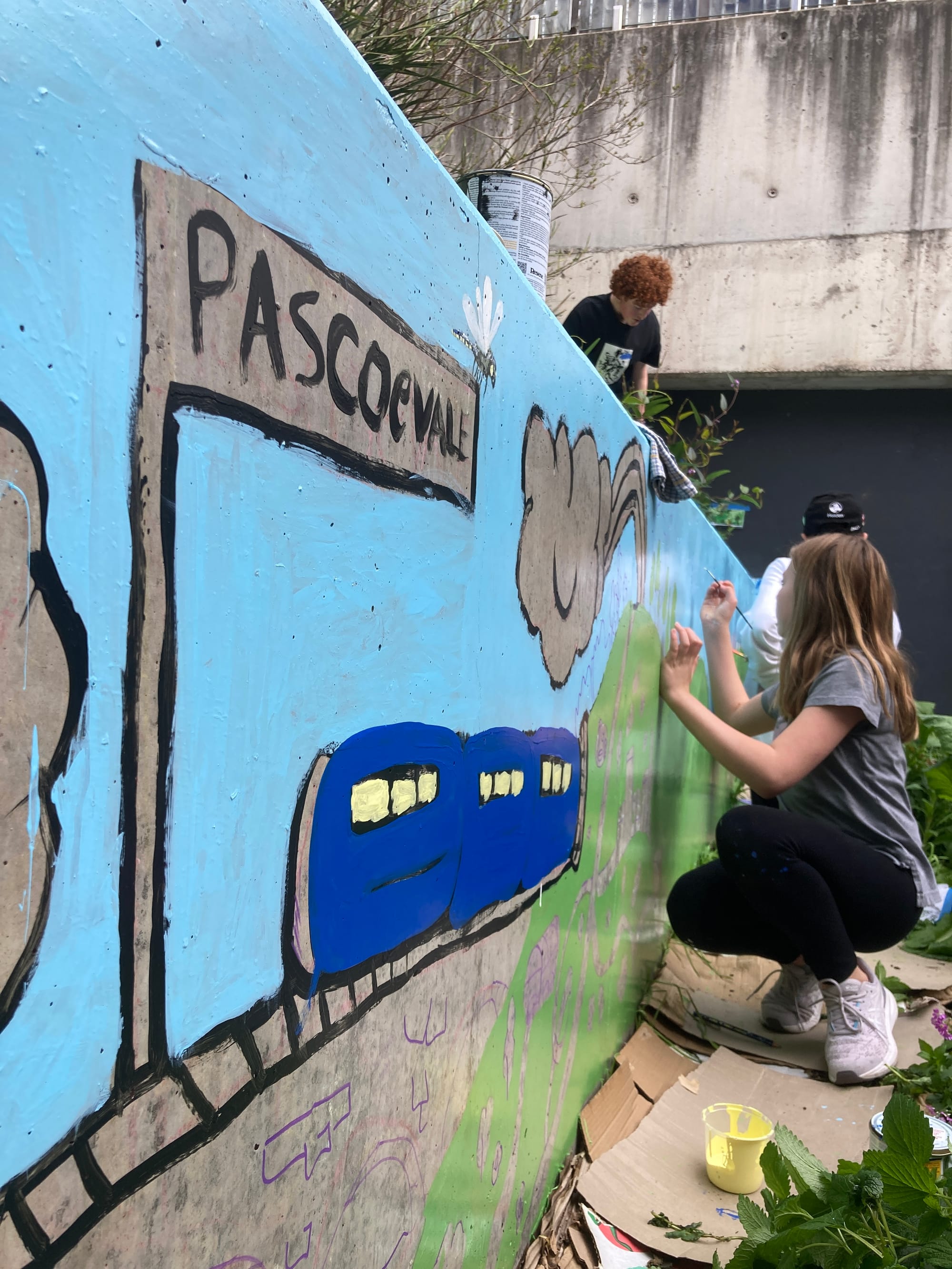 painting mural with youth at Sussex Neighbourhood House