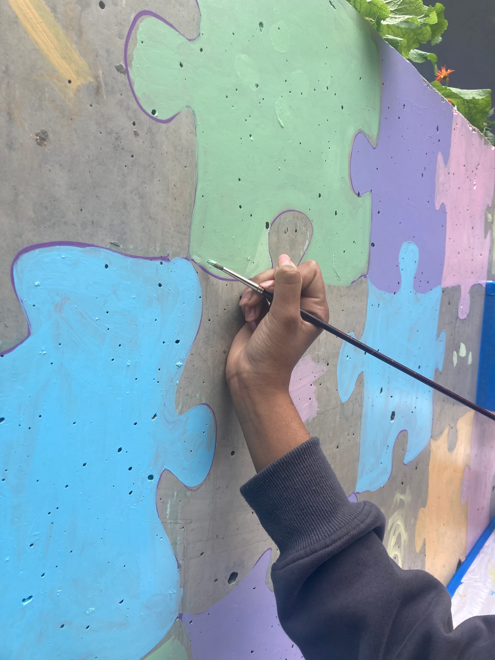 painting mural with youth at Sussex Neighbourhood House