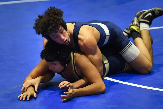 Eric Freeman of Paramus is on his way to defeat Owen Delgado of Ramsey in the 165 pound match of their quarter final during the Bergen County Wrestling Tournament Day 2 at Hackensack High School in Hackensack on Sunday, January 23rd, 2022.  