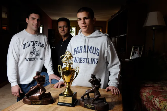 From 2009: Old Tappan coach Rob Ortiz prepares to face his father, Paramus assistant Jose Ortiz, and younger brother Joe Ortiz, who wrestled for Paramus at 125 pounds.