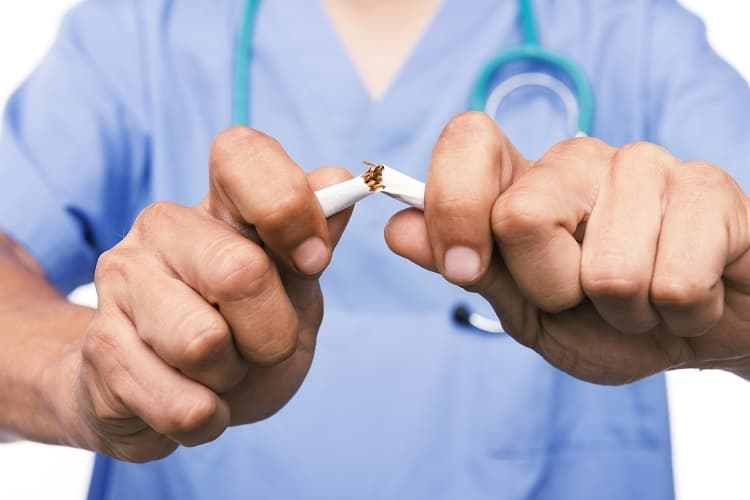 Photo of a doctor breaking a cigarette