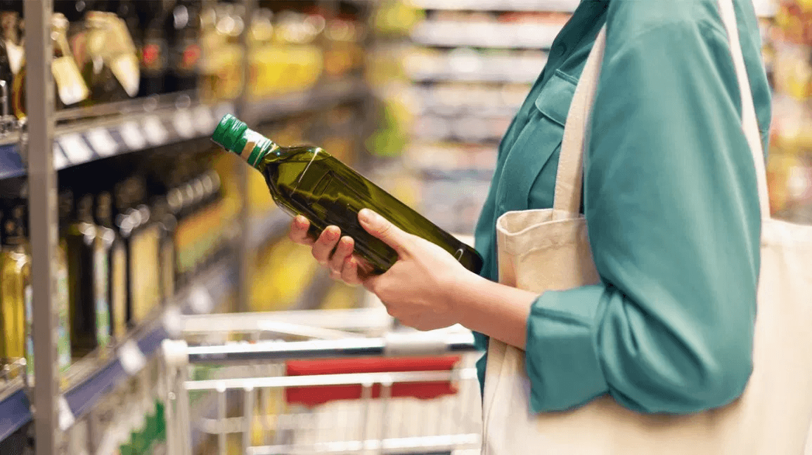 A woman shopping for olive oil