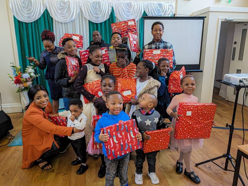 The Children with their Christmas gifts/Donations For Those In Need