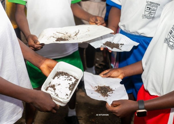 Students presenting their earthworms after a Soil Safari (Worm-finding exercise) to demonstrate the role of worms in the soil and the broader ecosystem
