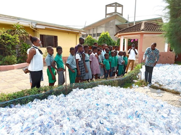 Students on a field trip to Trashy Bags Africa's upcycling facility in Abelenkpe to learn how used sachet water bags are transformed into other useful everyday items.