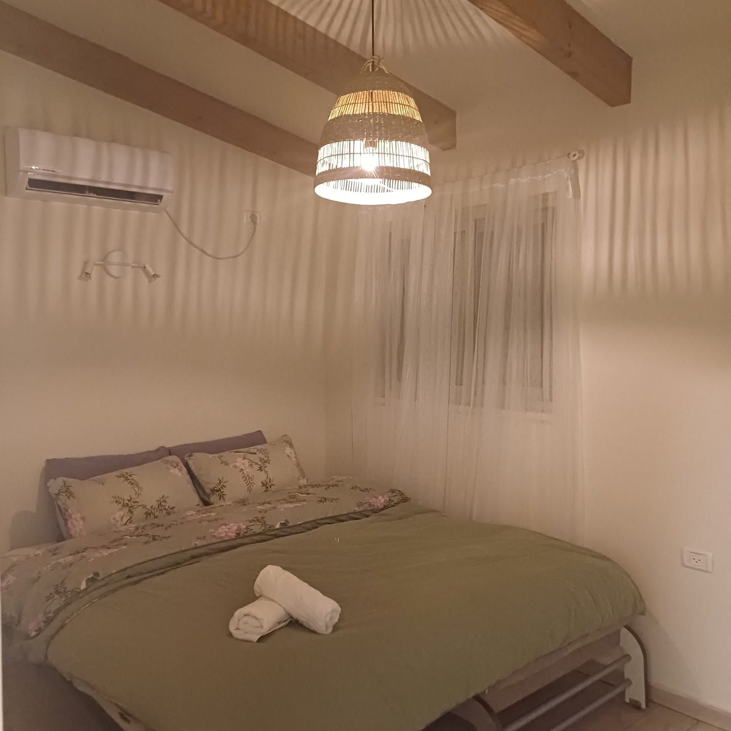 In the settlement of Mizd, a luxurious rural vacation complex in a central location (right behind the station), close to synagogues, a mikveh, and a grocery store. Includes two units that can also be rented separately. Ground floor house includes two air-conditioned bedrooms, a bedroom for a couple, and a children's room. Total of 6 beds.