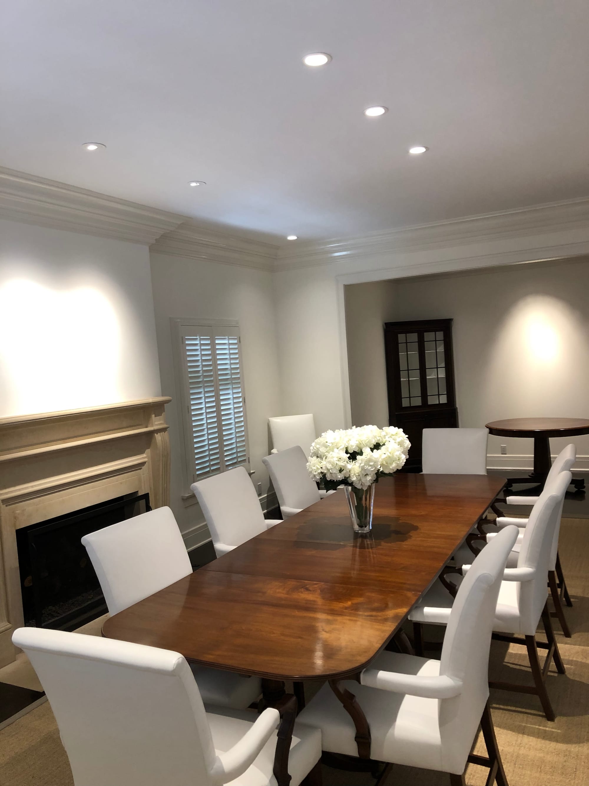 White-Glove Setup of Fine Dining Table with White Leather Chairs. | Beverly Hills