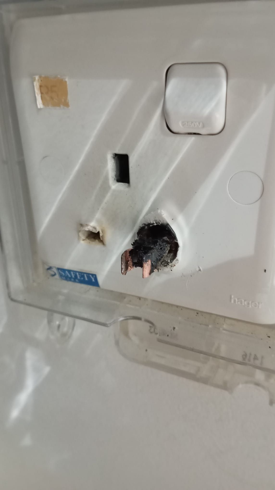 power plug pin stuck in socket with burn mark